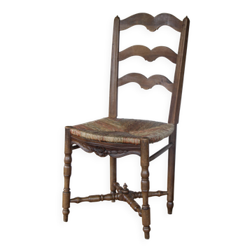 Antique chair with coloured rush seating.