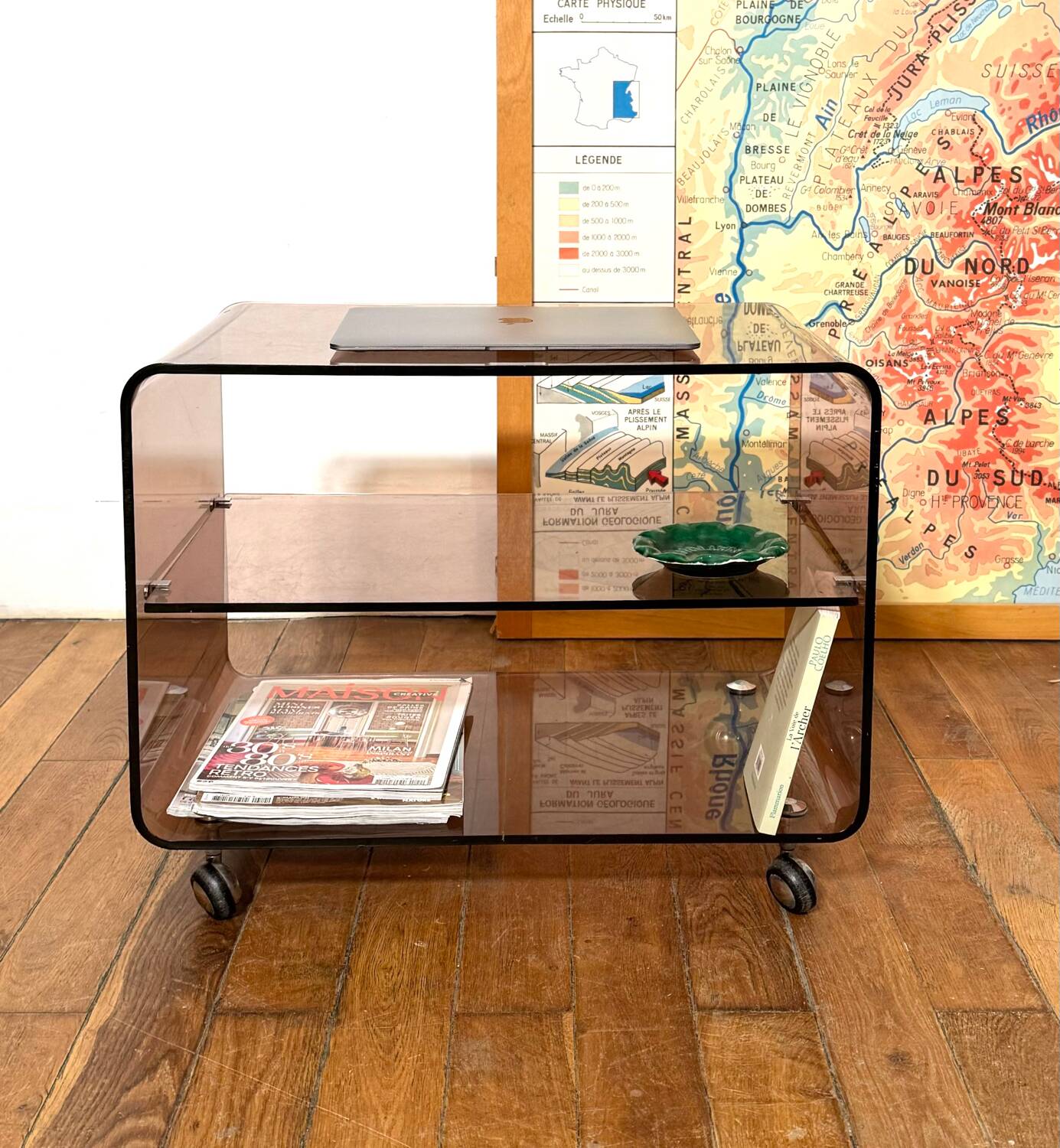 Smoked Plexiglas coffee table on wheels -