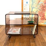 Smoked Plexiglas coffee table on wheels -