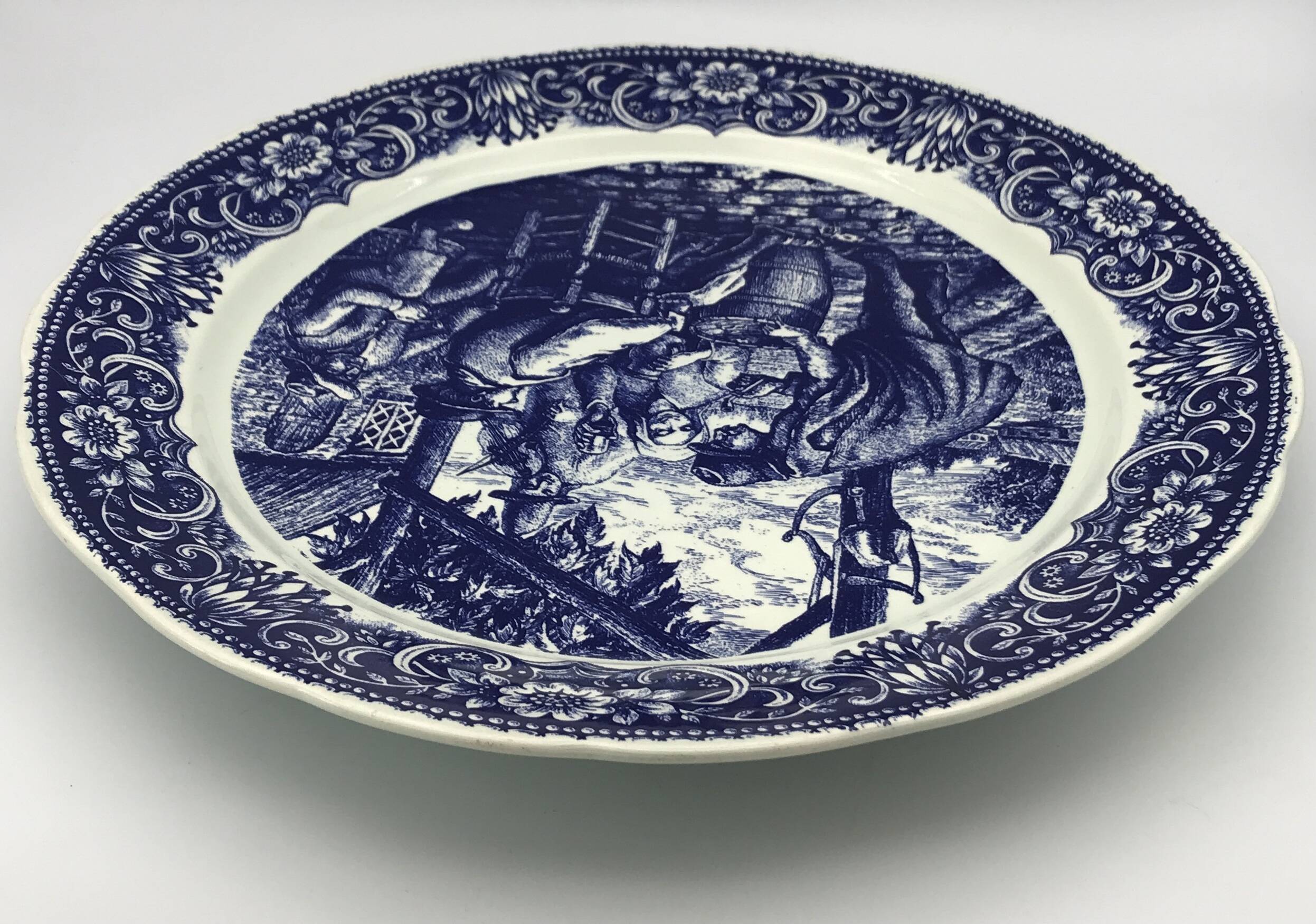 Blue enamelled earthenware wall dish with peasant scene decor Boch La Louvière