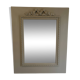 Wooden mirror with patinated beige knot