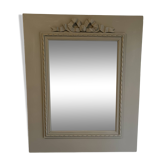 Wooden mirror with patinated beige knot
