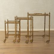 Set of 3 vintage Hollywood Regency nesting tables with brass frame and glass tops (1960s)