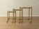 Set of 3 vintage Hollywood Regency nesting tables with brass frame and glass tops (1960s)