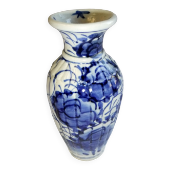 Old Chinese ceramic vase decorated with white blue flowers