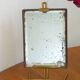 Table mirror on a brass easel