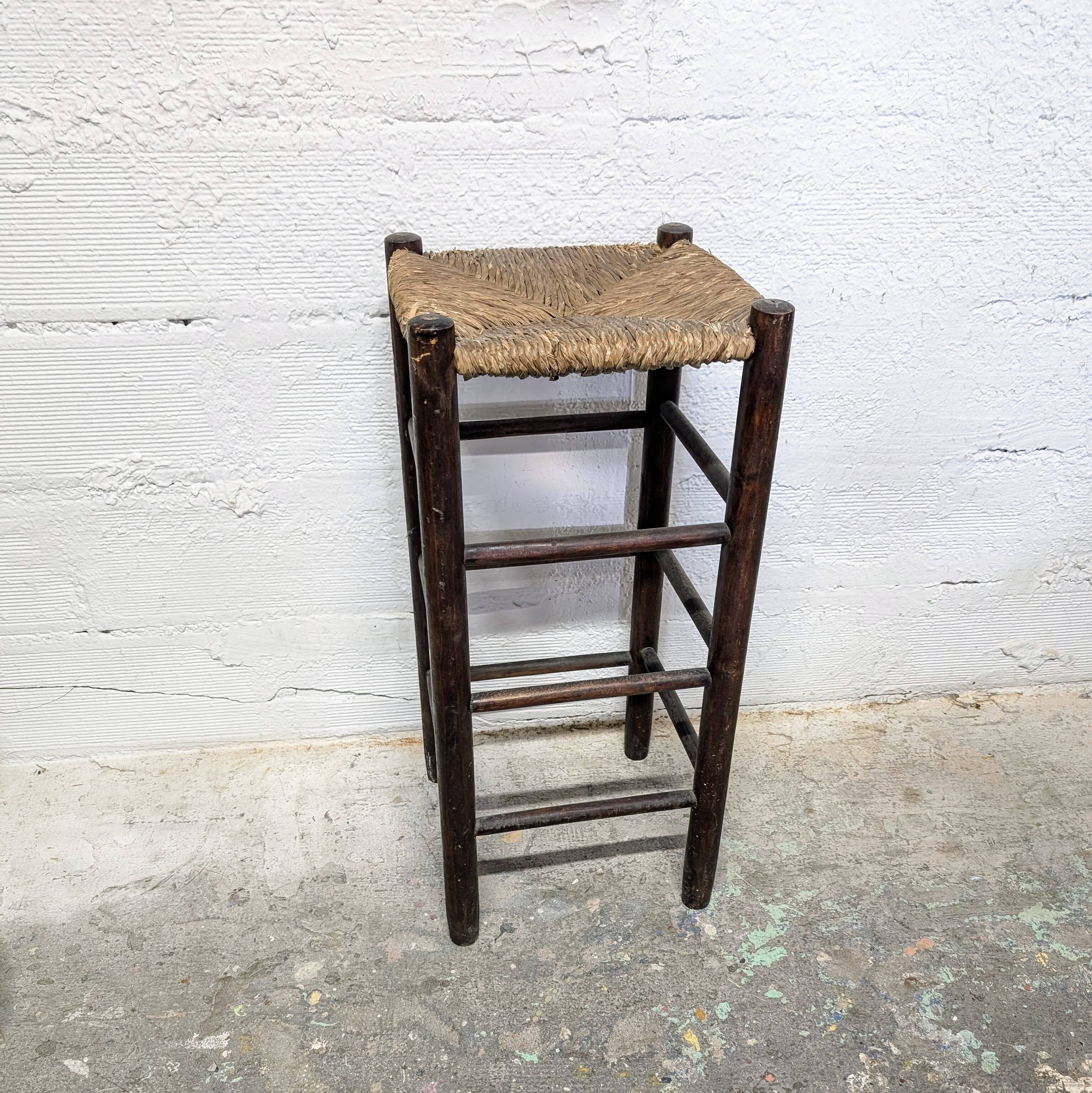High stool made of wood and straw