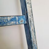 Old ladder in blue wood