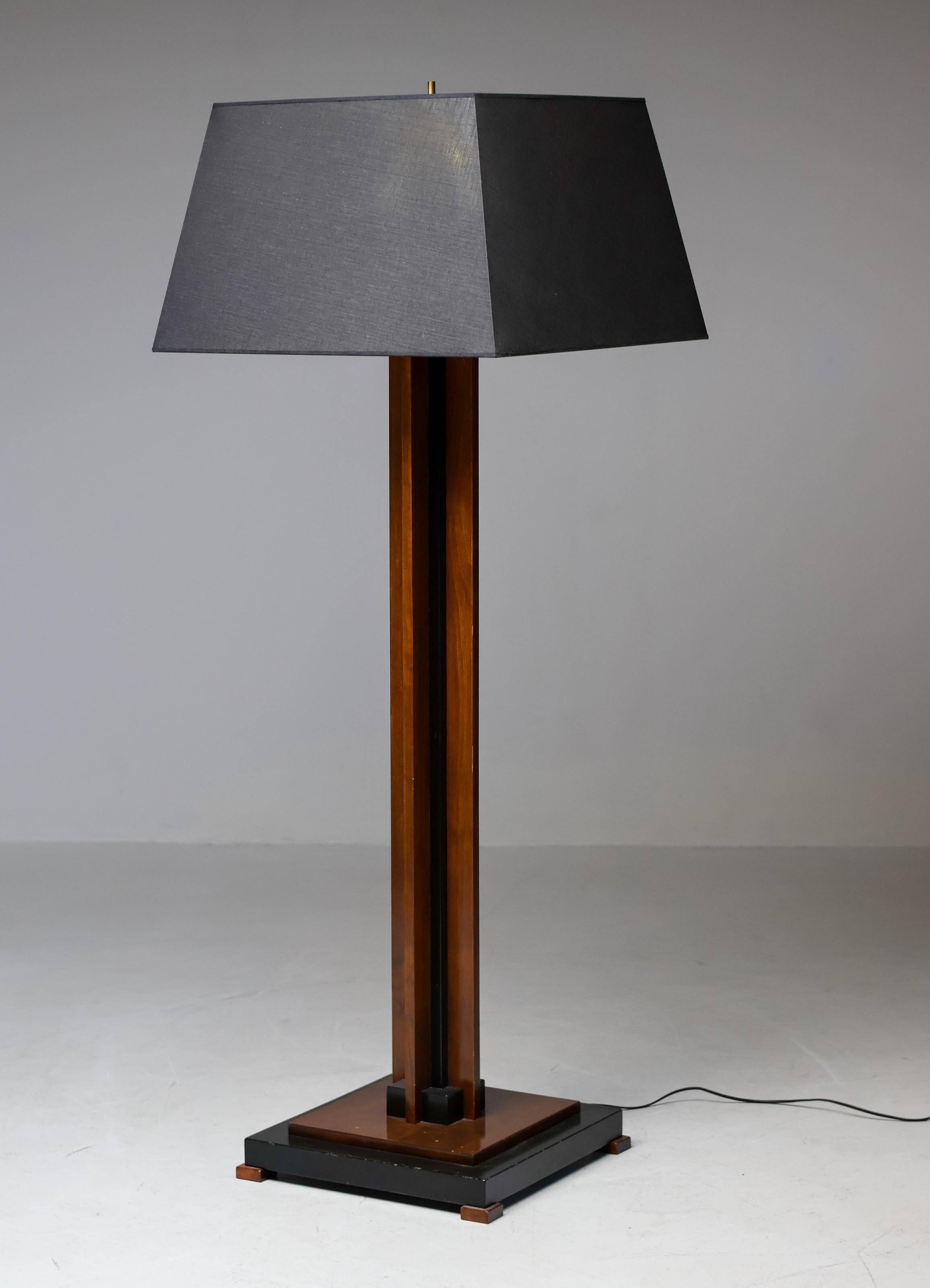 Amsterdam School floor lamp in partially ebonised cherry with a black linen shade.