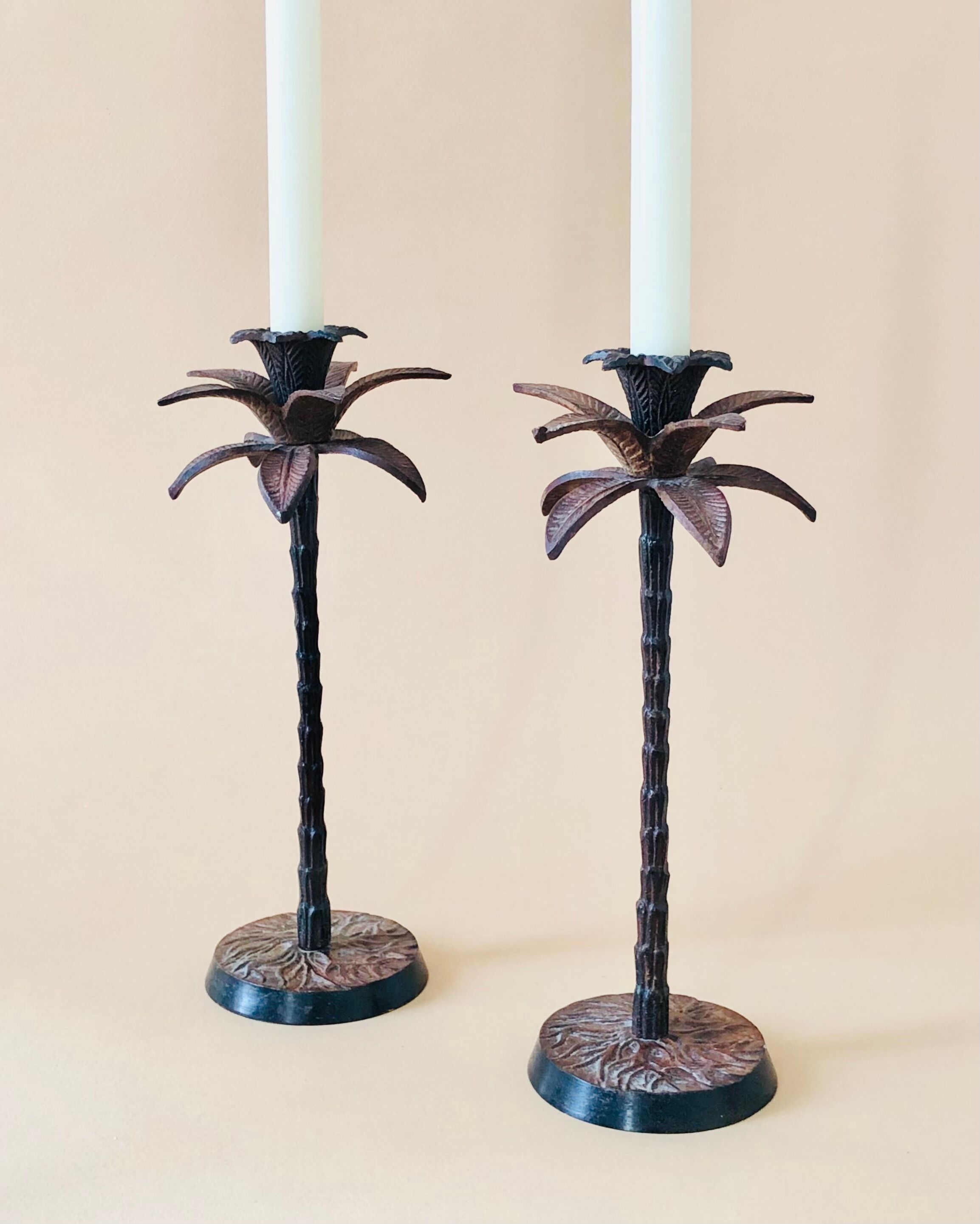 Pair of patinated metal candlesticks
