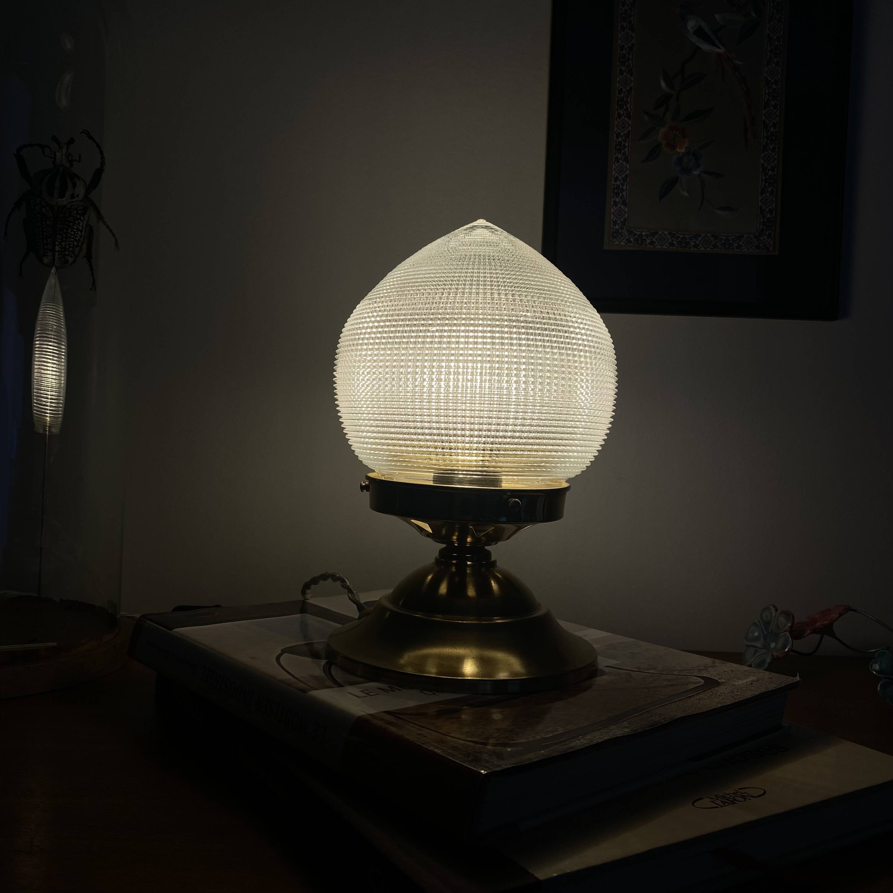 Antique globe table lamp in glass, Holophane type, and brass.