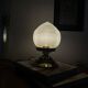 Antique globe table lamp in glass, Holophane type, and brass.