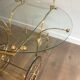 Neo classical style table in silver and gold metal and glass