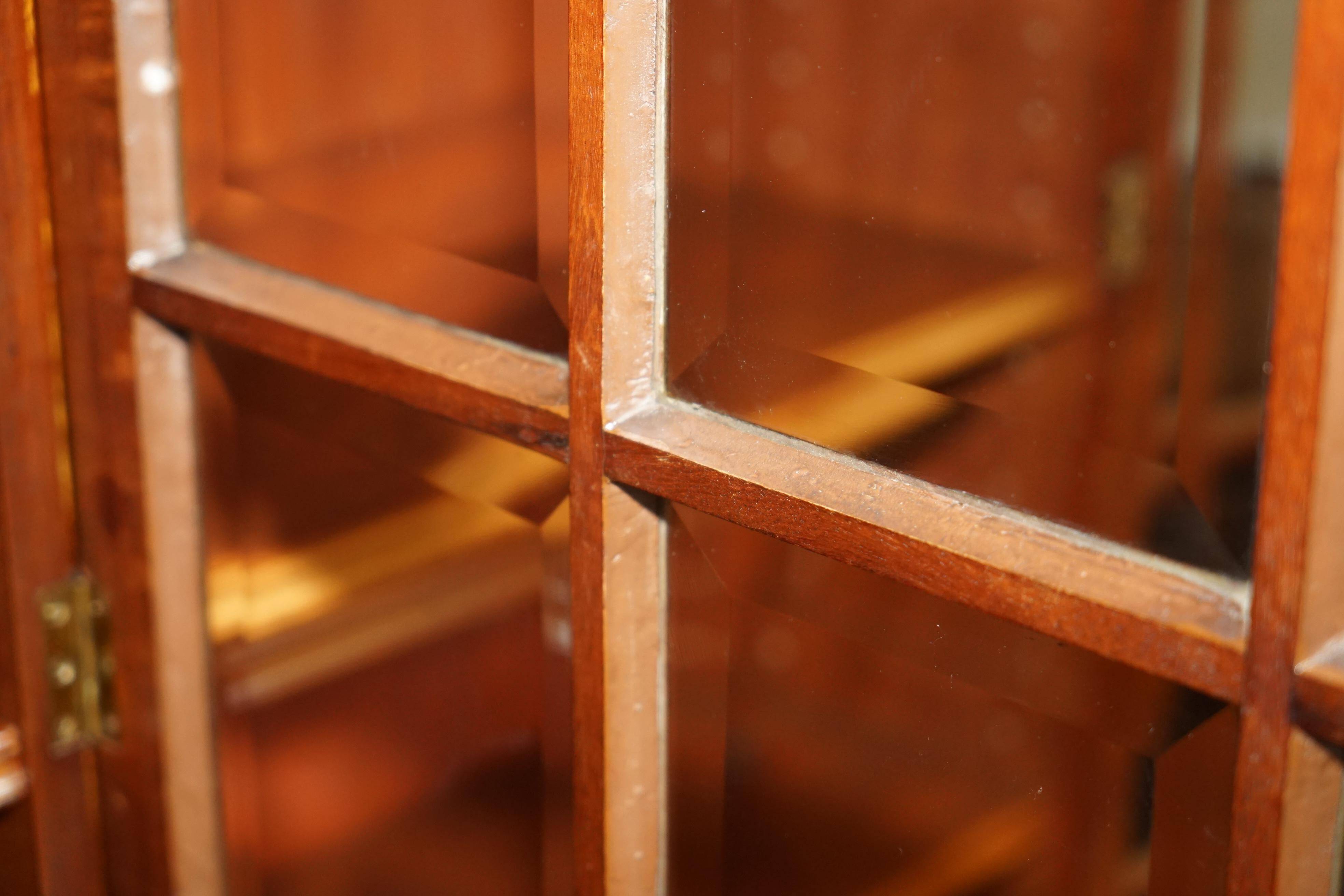 Monumental glass library in Victorian hardwood.