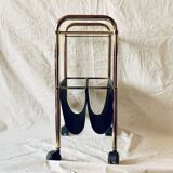 Magazine rack, saddle on vintage wheels