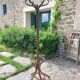 dark-coloured wooden coat rack parrot
