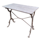 Antique bistro table with iron legs and wooden top