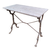 Antique bistro table with iron legs and wooden top