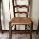 Wooden and straw chairs