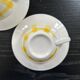Pair of yellow checkered mugs