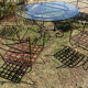 Wrought iron table and chairs for indoor/outdoor use.