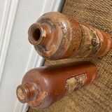 Duo of bottles in ancient sandstone