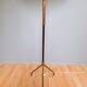 Vintage tripod floor lamp in black lacquered metal and brass, 50s
