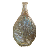 Shell bottle in molded glass