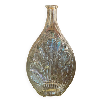 Shell bottle in molded glass