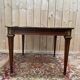 Table extensible style Louis XVI – Plateau cuir doré au petit fer – Bronze doré