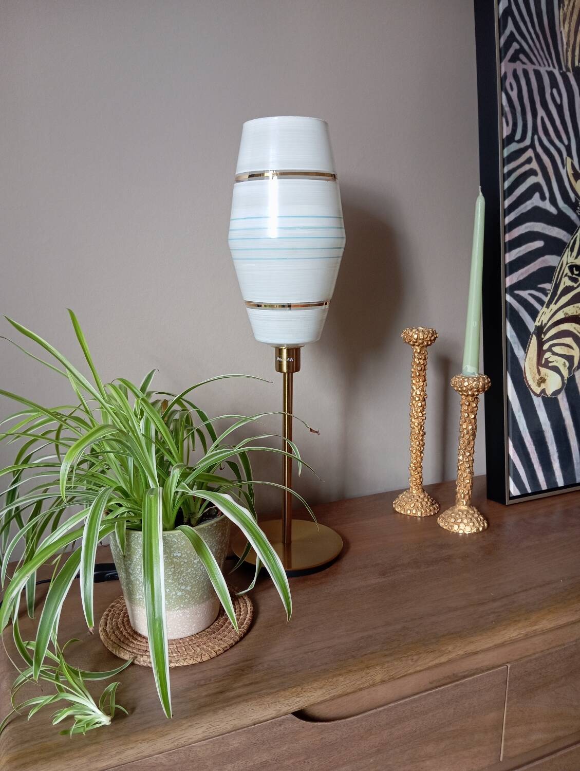 Mid-century gold metal table lamp with white striped shade