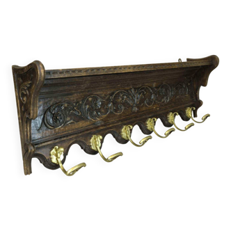 Vintage wall-mounted coat rack in solid wood.