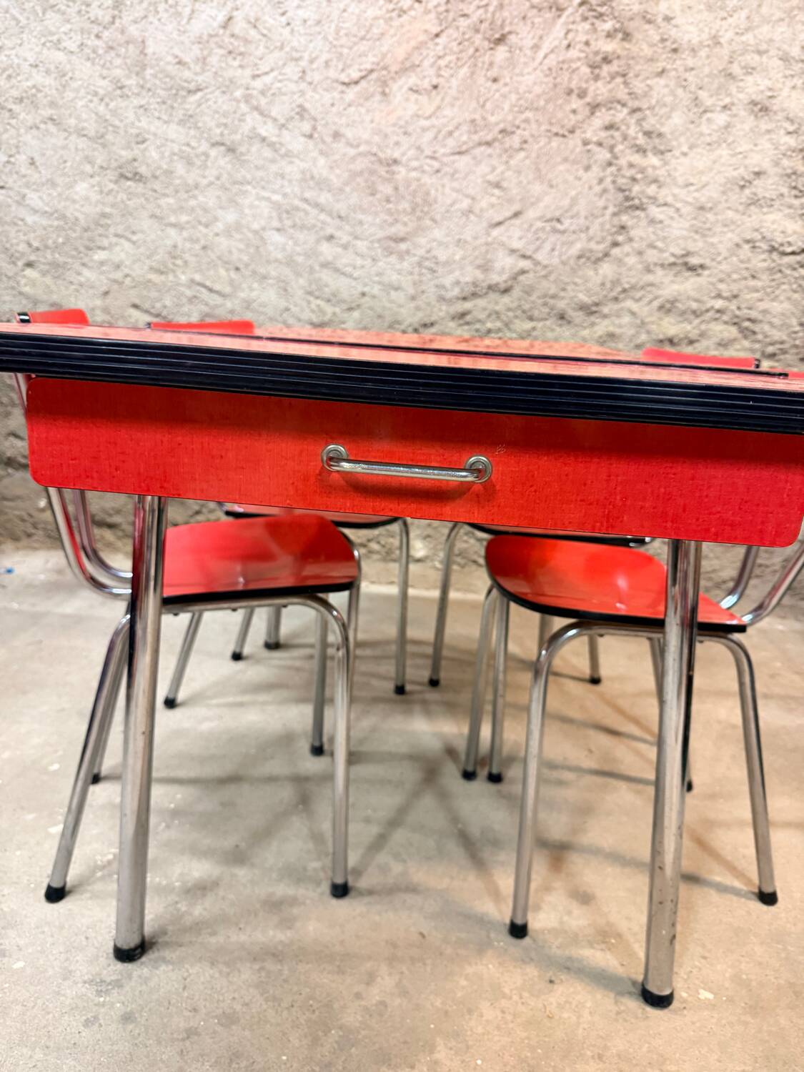 4 red Formica chairs with a 1970s table