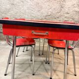 4 red Formica chairs with a 1970s table