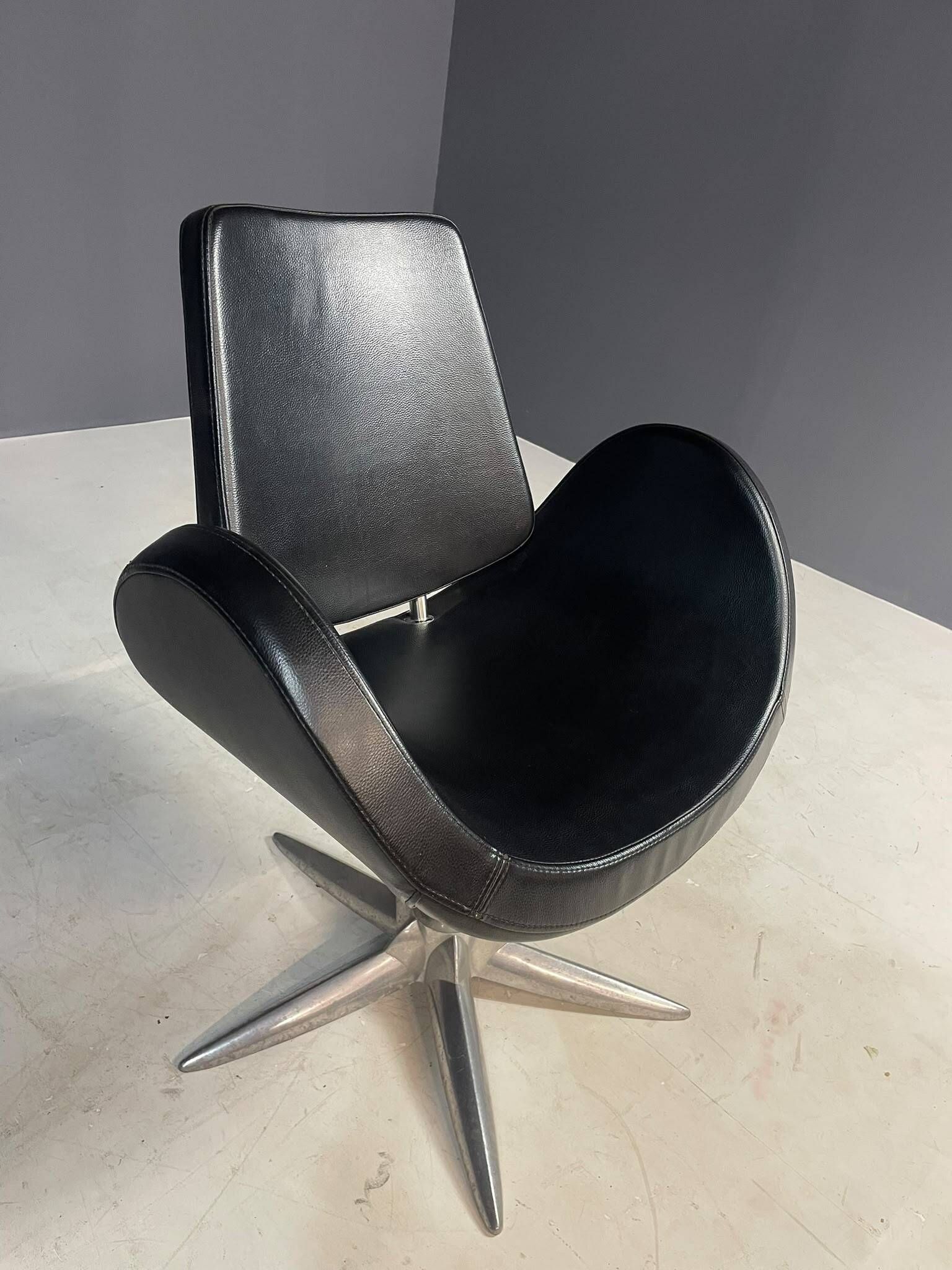 Alipes black swivel salon chair with chrome star base by Giorgetto Giugiaro