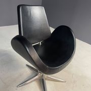 Alipes black swivel salon chair with chrome star base by Giorgetto Giugiaro