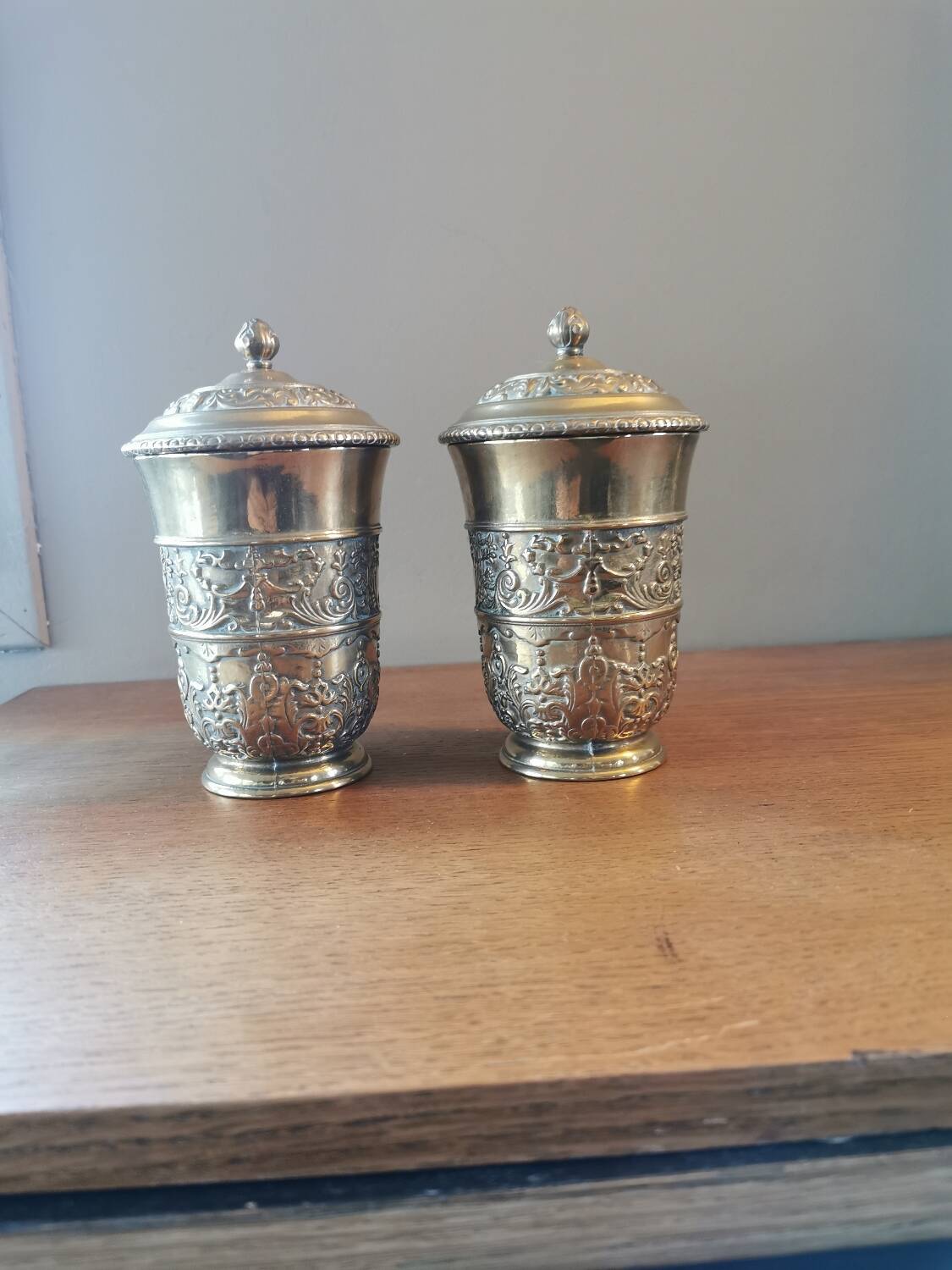 Pair of antique chiseled metal candy boxes