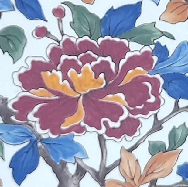 Underside of flat wood and faience floral pattern - retro