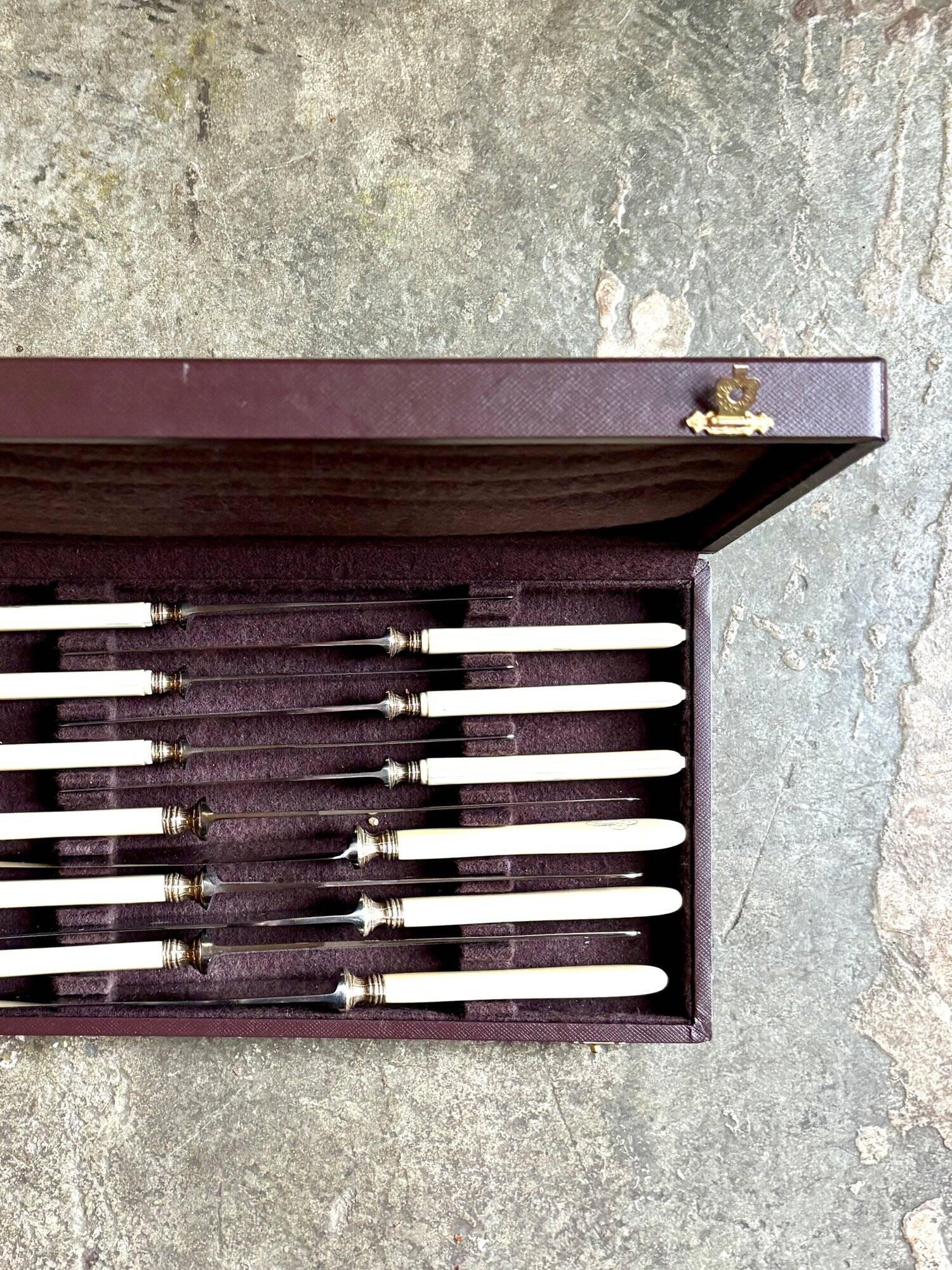 12 stainless steel and monogrammed bone knives