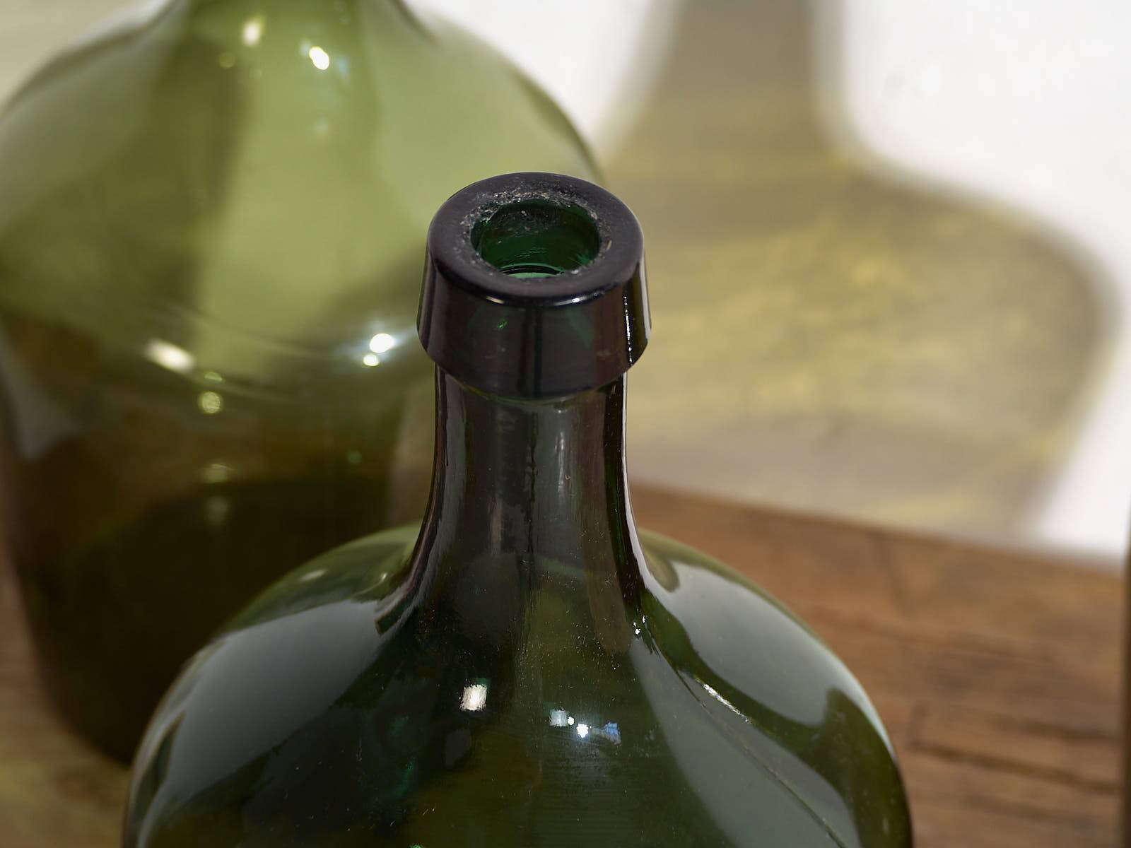 Antique green demijohns (circa 1920). Set of 3 pieces