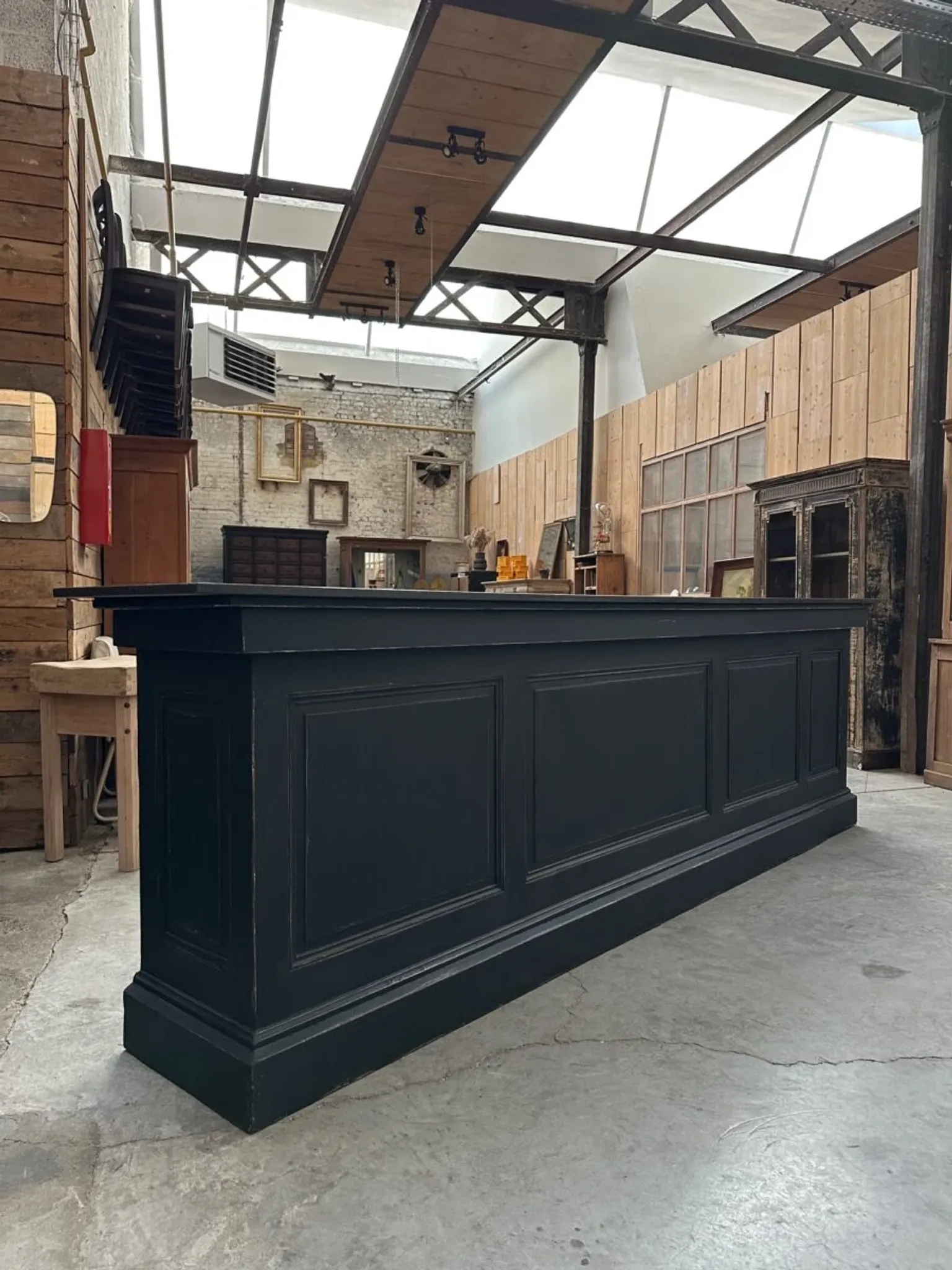 Immense bar counter covered with blue stone.