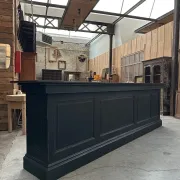 Immense bar counter covered with blue stone.