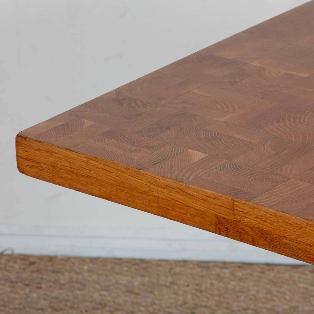 Square wooden dining table with a pedestal from the 1980s.
