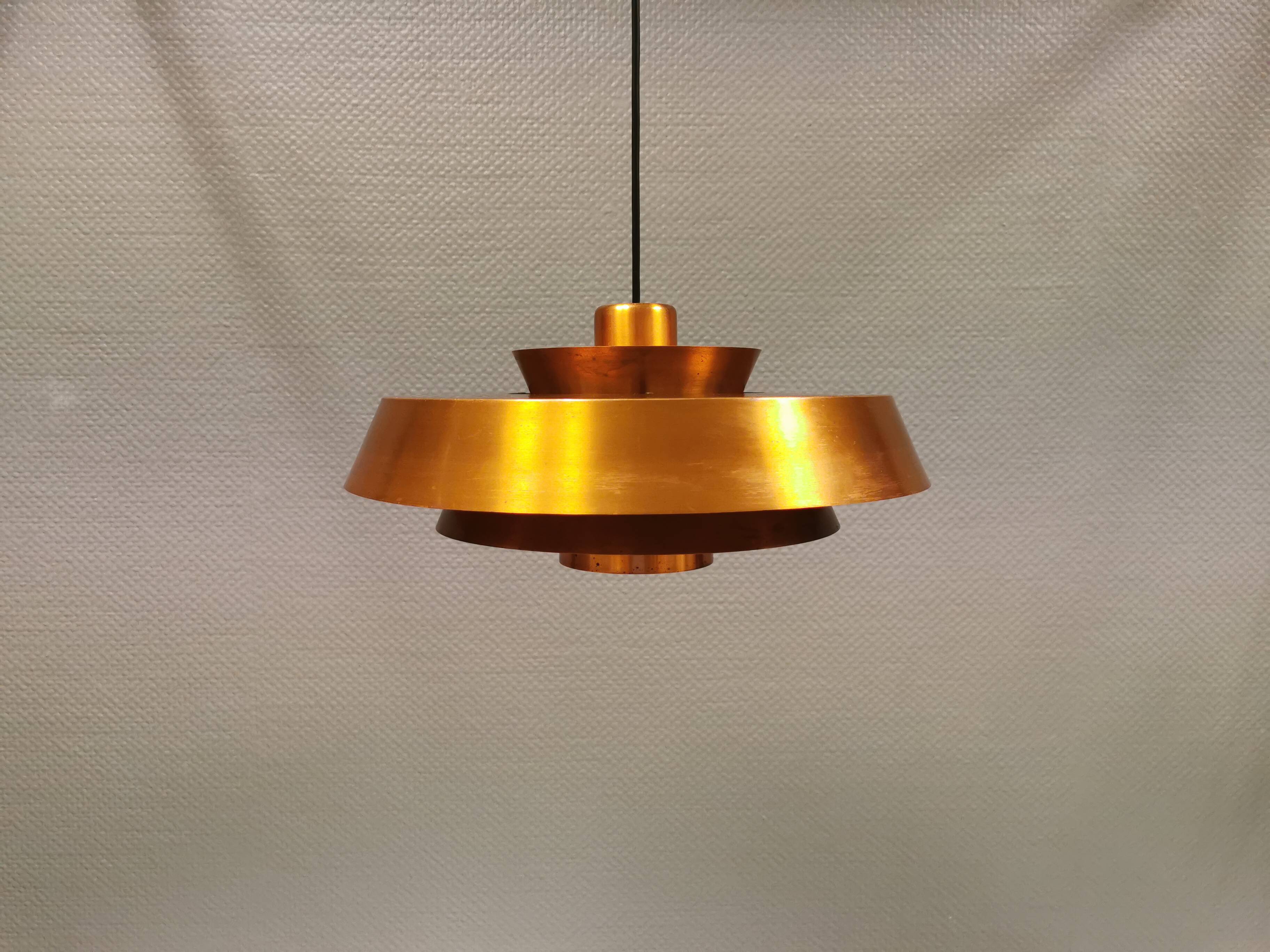 A mid-century Danish hanging lamp in copper by Jo Hammerborg for Fog & Mørup.