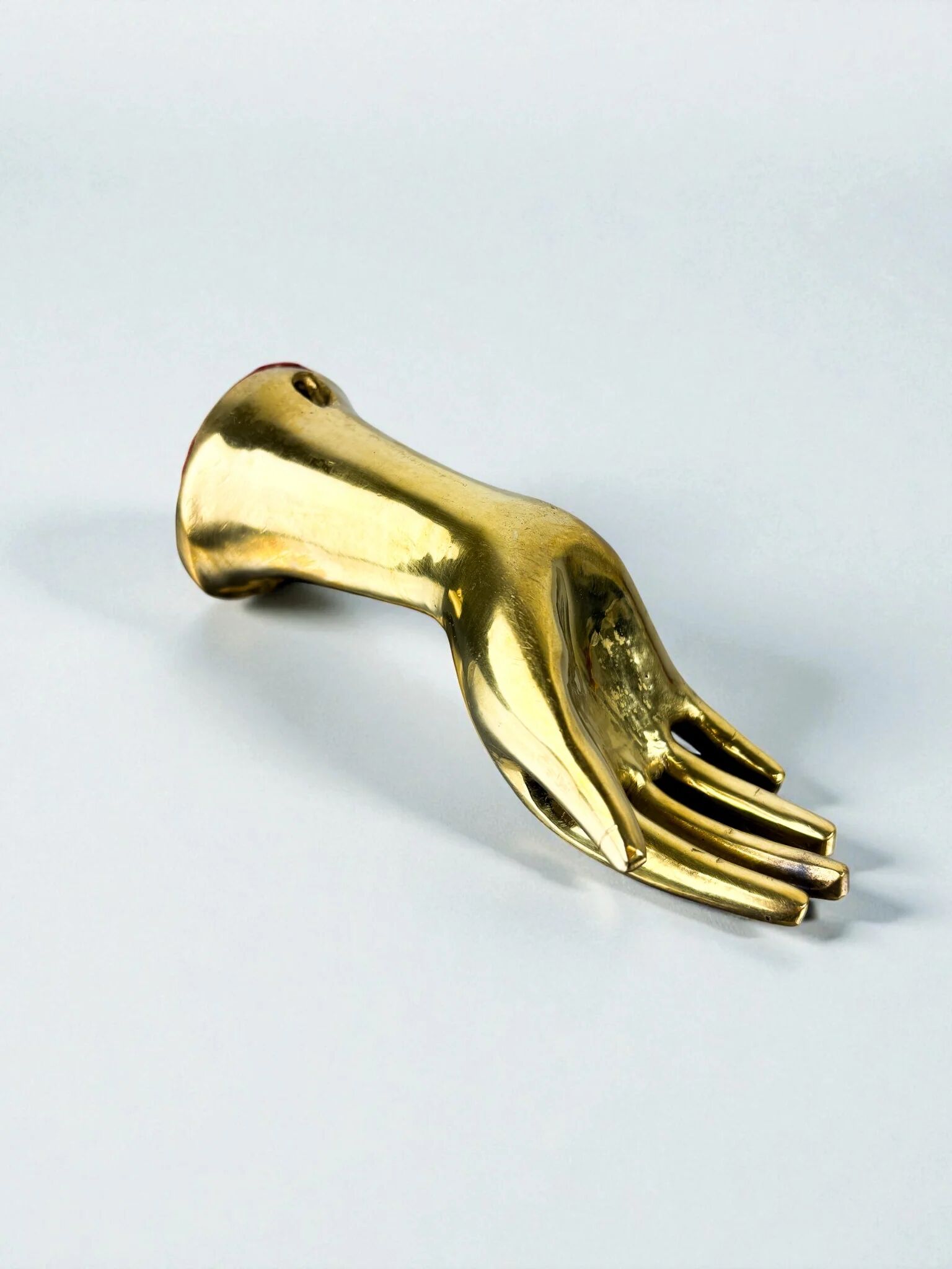 Bronze hand-shaped wall hook, gilded finish, Italy, 1970s