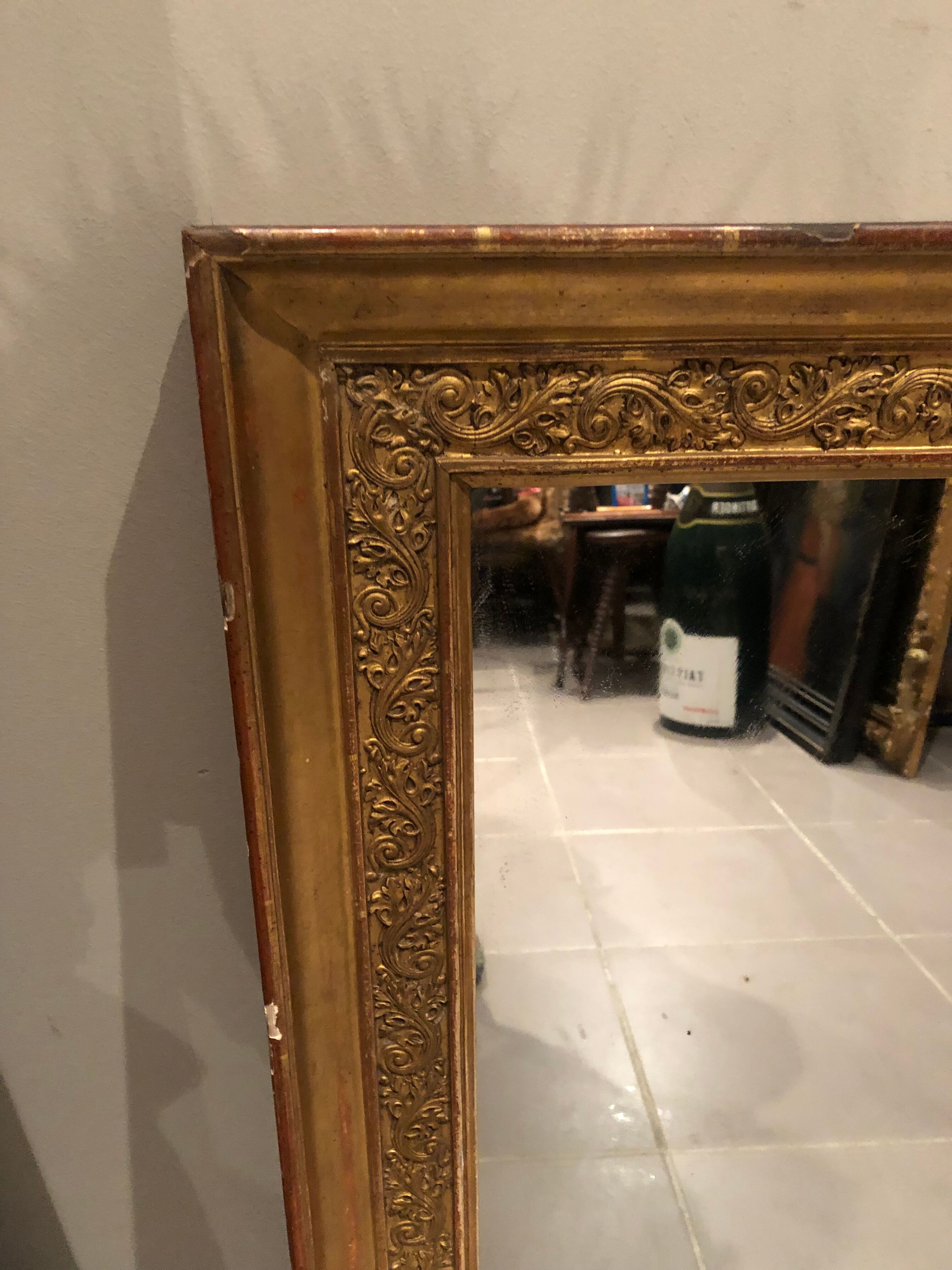 Old 19th century mirror in wood and gilded stucco