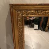 Old 19th century mirror in wood and gilded stucco