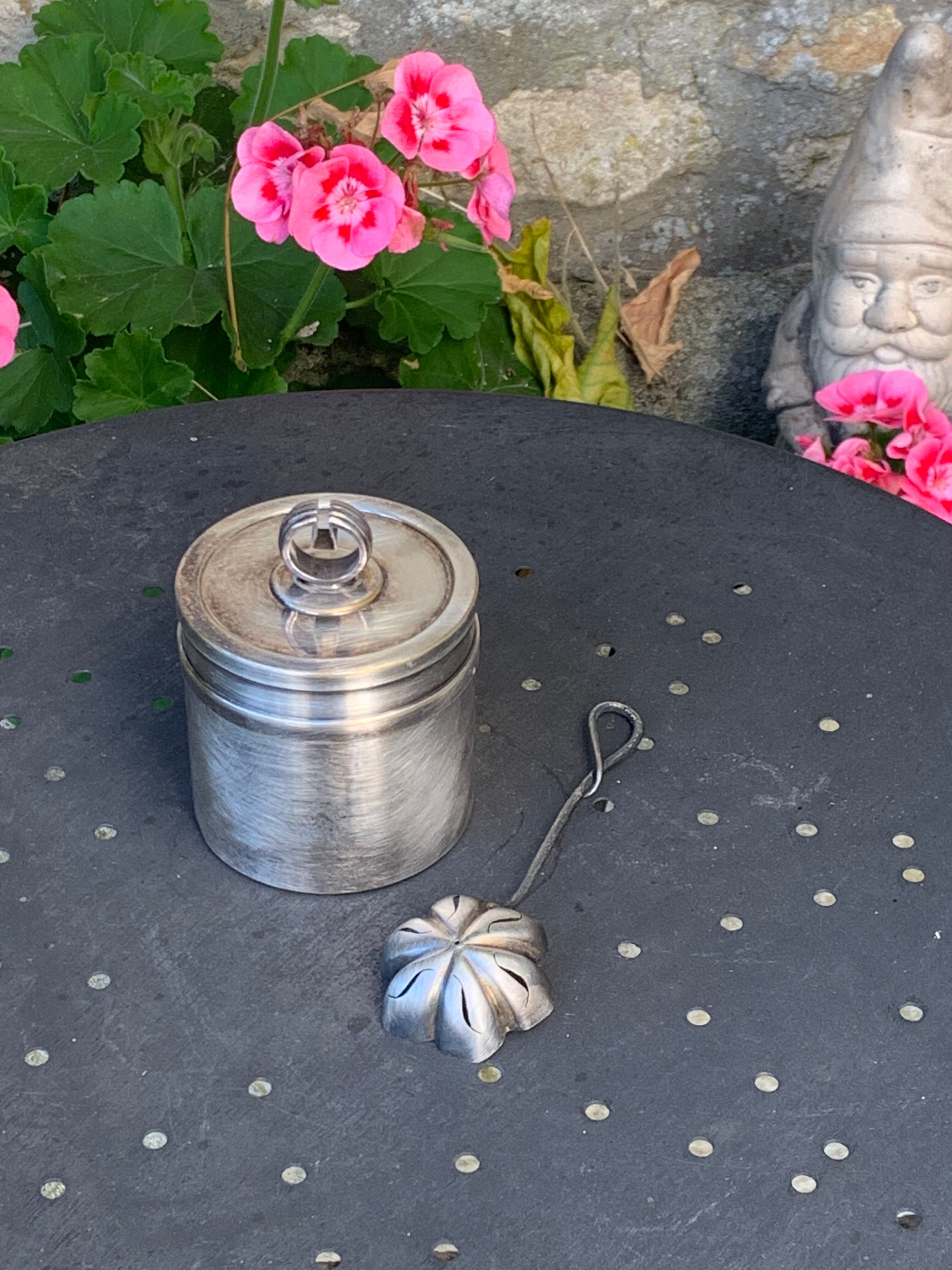 Sprinkling spoon and art deco sugar pot in silver metal