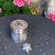 Sprinkling spoon and art deco sugar pot in silver metal