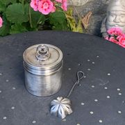 Sprinkling spoon and art deco sugar pot in silver metal